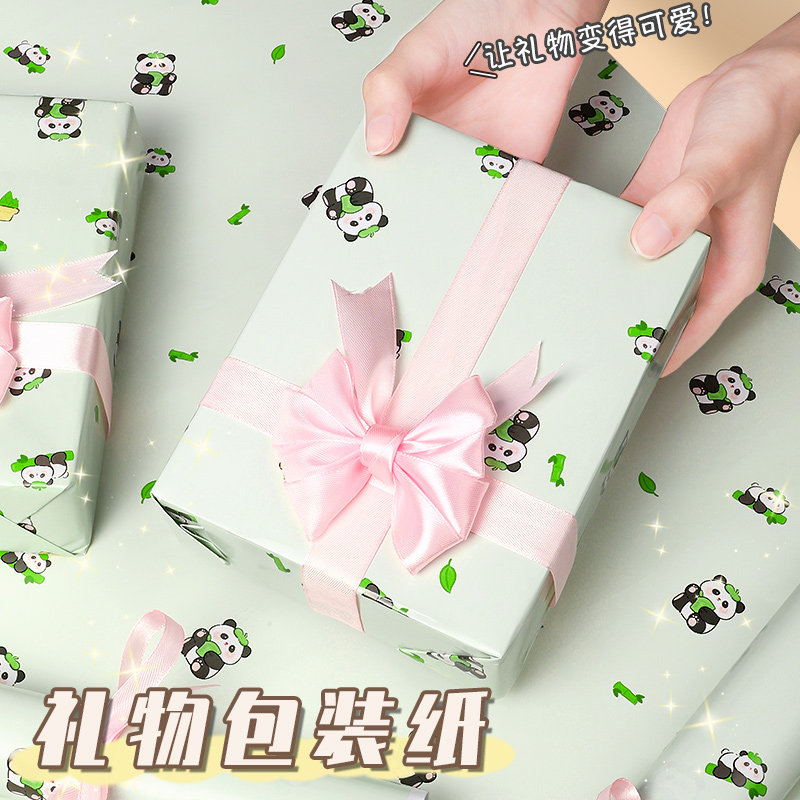 高颜值卡通彩纸加丝带礼物包装纸图片