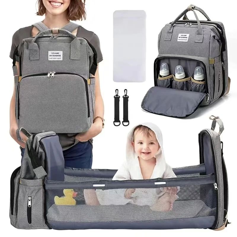 Foldable bed diaper bag with changing station ulated pocket