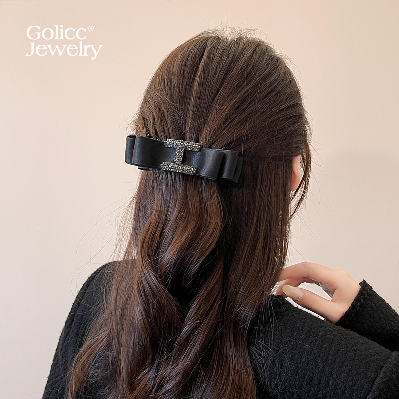 古里雅H字母蝴蝶结抓夹高级感