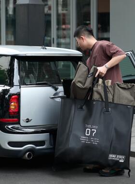 日本SLOWER户外露营挂式收纳袋便携式行李袋大容量黑色防水手提袋