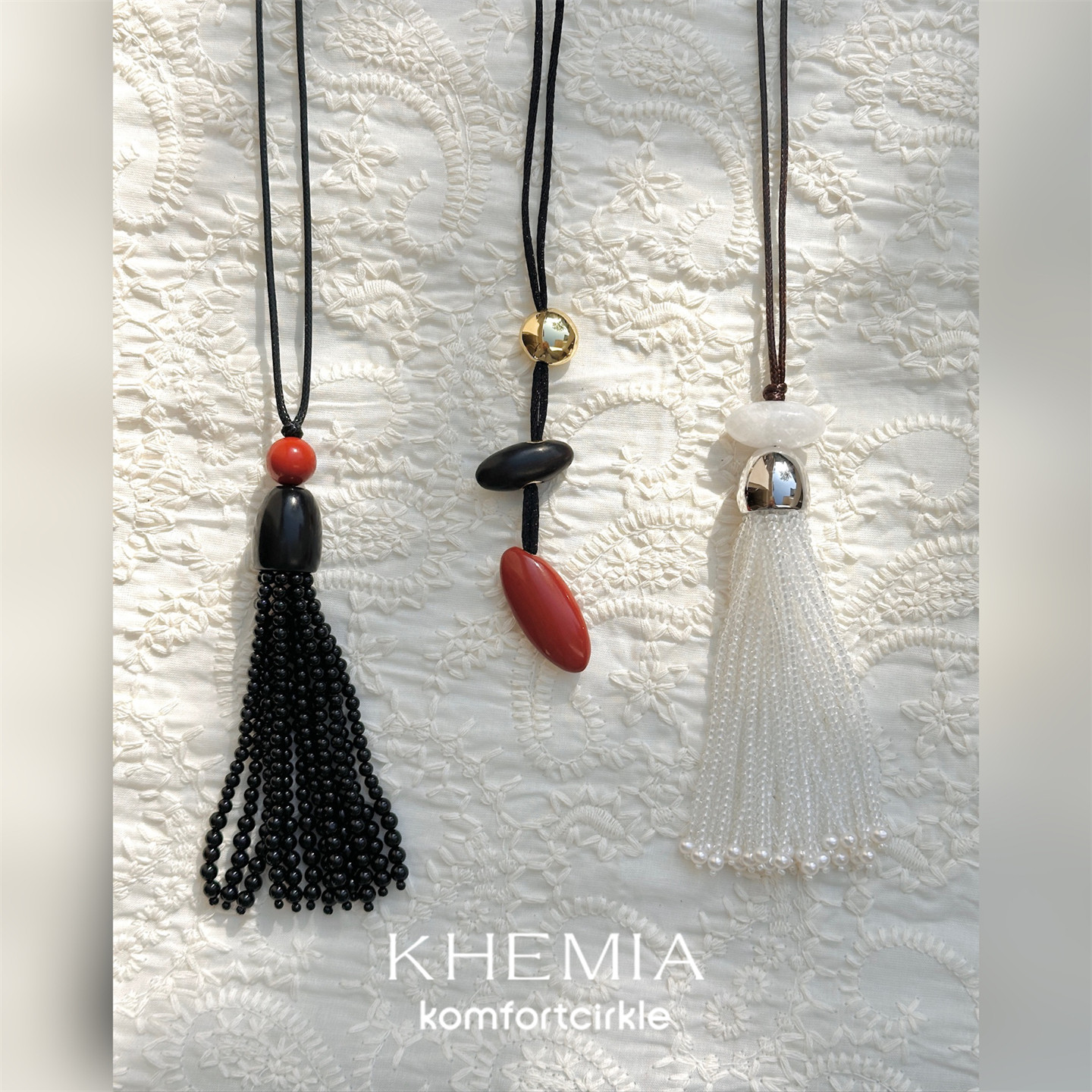 KHEMIA 项链新年新品 金豆红石黑檀木绯弦链可调节流苏毛衣链女图片