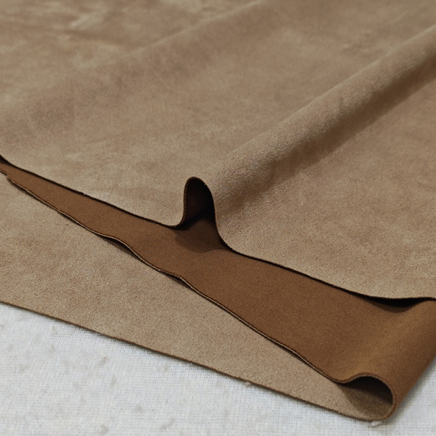 米黄弹力麂皮绒布料服装沙发面料