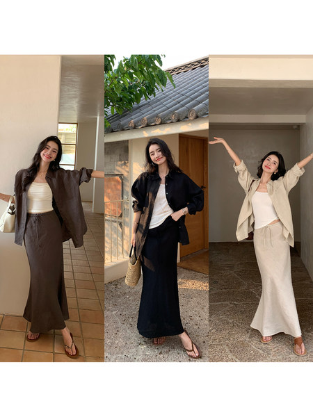 Three models wearing coordinated long skirt and button-up shirt sets in brown, black, and beige