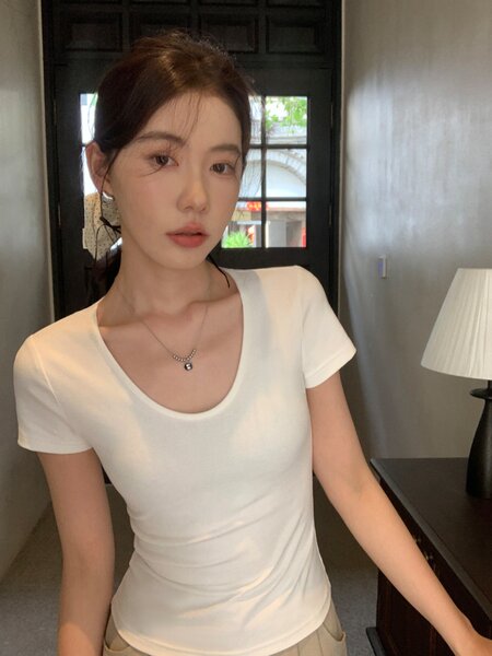 White fitted short-sleeve scoop neck t-shirt worn by a model