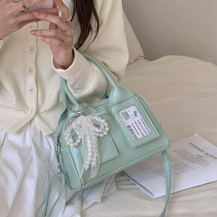 韩国ins甜美手提保龄球包包女2026新款时尚枕头包百搭斜挎包痛包