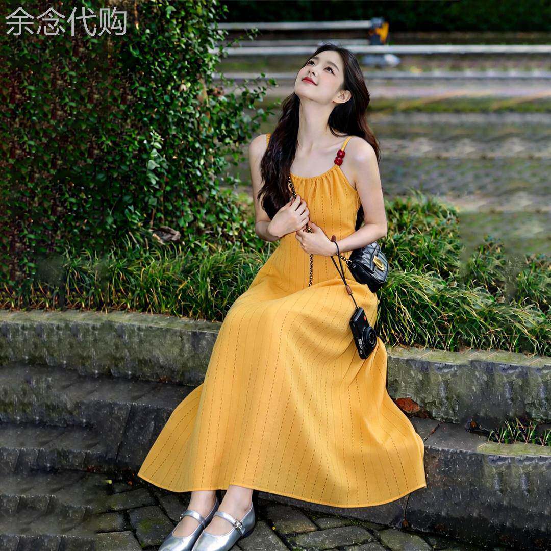 法式气质黄色吊带洋装女2026夏季新款度假独特超好看无袖长裙子