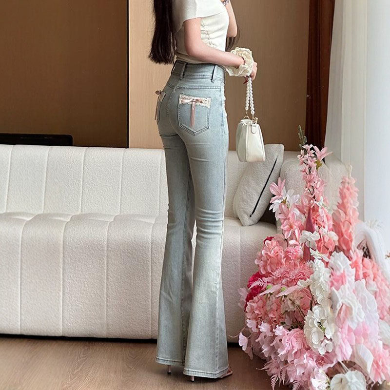 李李服饰蝴蝶结蕾丝拼接微喇牛仔裤女2026春季提臀显瘦喇叭裤