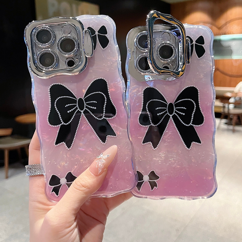 适用苹果系列iPhone16新款手机壳15pro14promax时尚个性黑色蝴蝶结13/16promax全包隐形支架镜头膜网红保护套