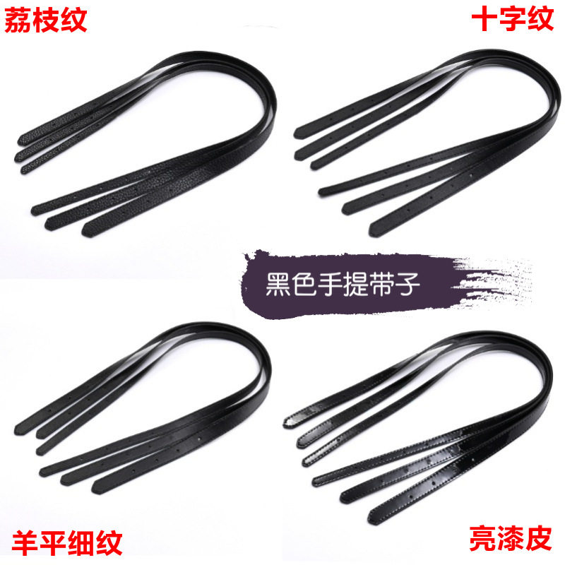 手提打孔手拎带黑色十字纹皮包