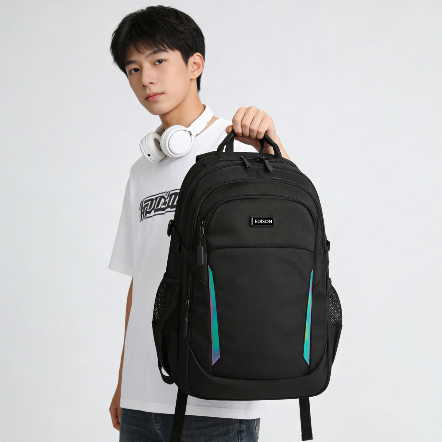 爱迪生护脊减负高中生书包潮男初中镭射反光双肩包大容量旅行背包