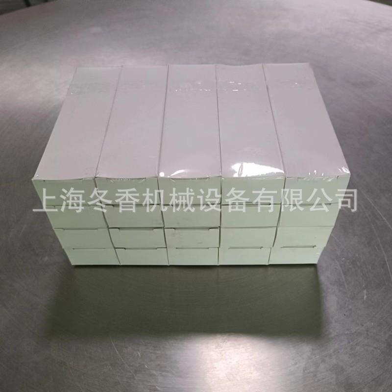 2005型可调式透明膜三维包装机、化妆品薄膜裹包机、智能型烟包机