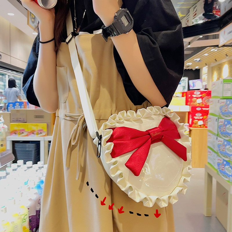 日系帆布包设计褶皱蝴蝶结2021新款可爱jk制服学生爱心斜挎包包女