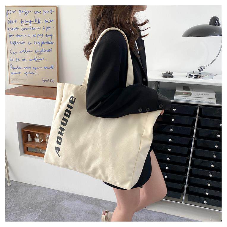 新款女包字母印花简约通勤手提帆布包大容量学生上课托特包