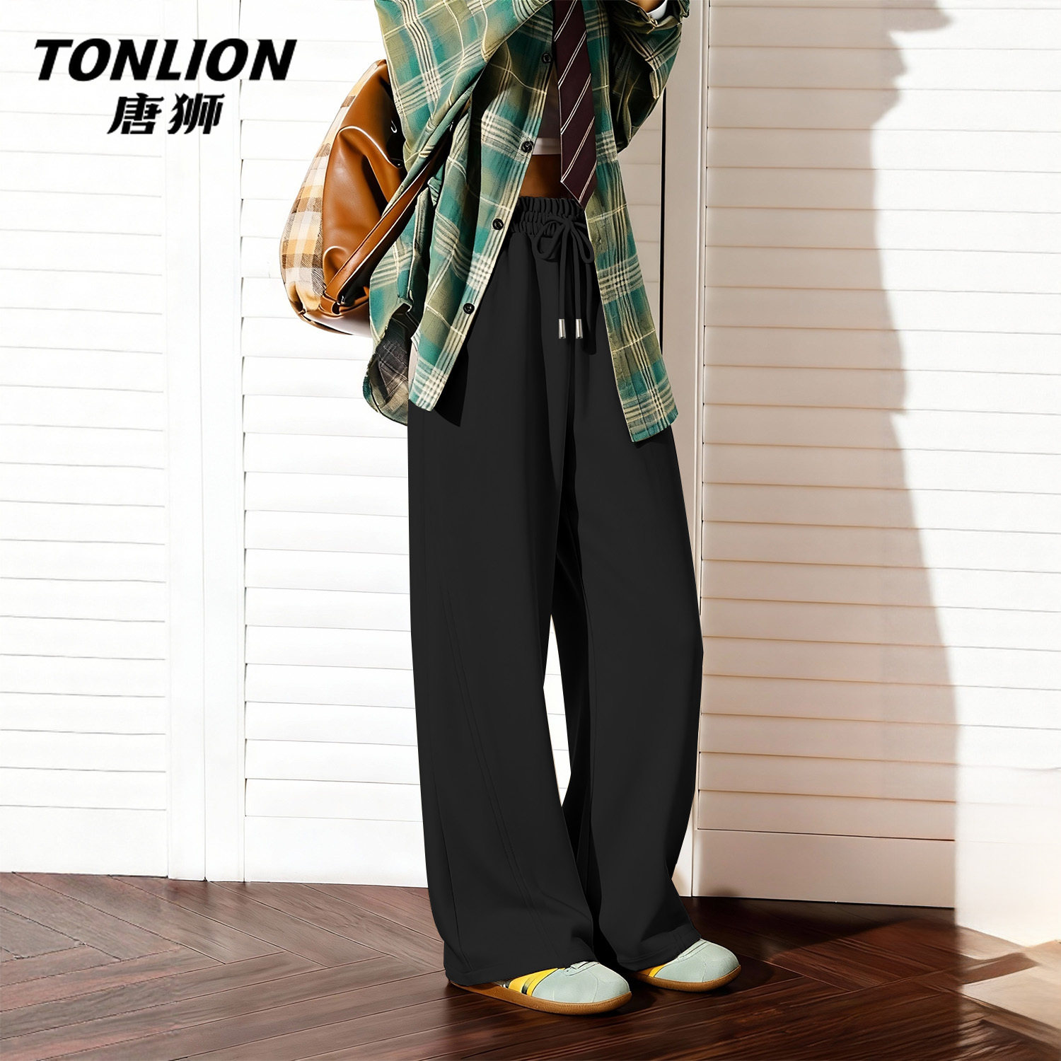 唐狮官方黑色窄版香蕉裤女春秋款2026新款女士宽松直筒运动裤子V
