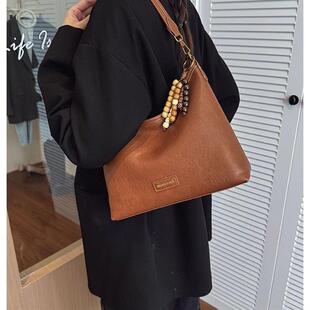 真皮今年流行爆款腋下包包女2025新款法式超火复古外出斜挎托特包