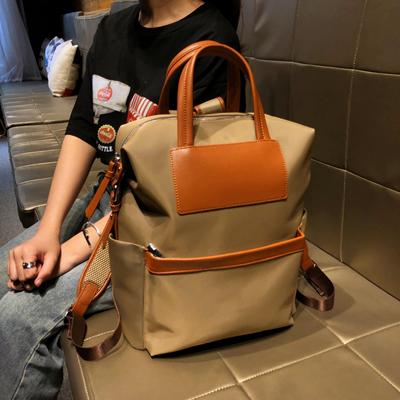 香港品牌双肩包女2025新款时尚设计轻便书包大容量旅行通勤背包男