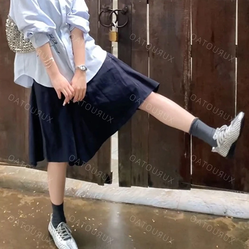 天丝莫代尔藏蓝色半身裙女春夏2026年新款高腰显瘦不规则a字裙子