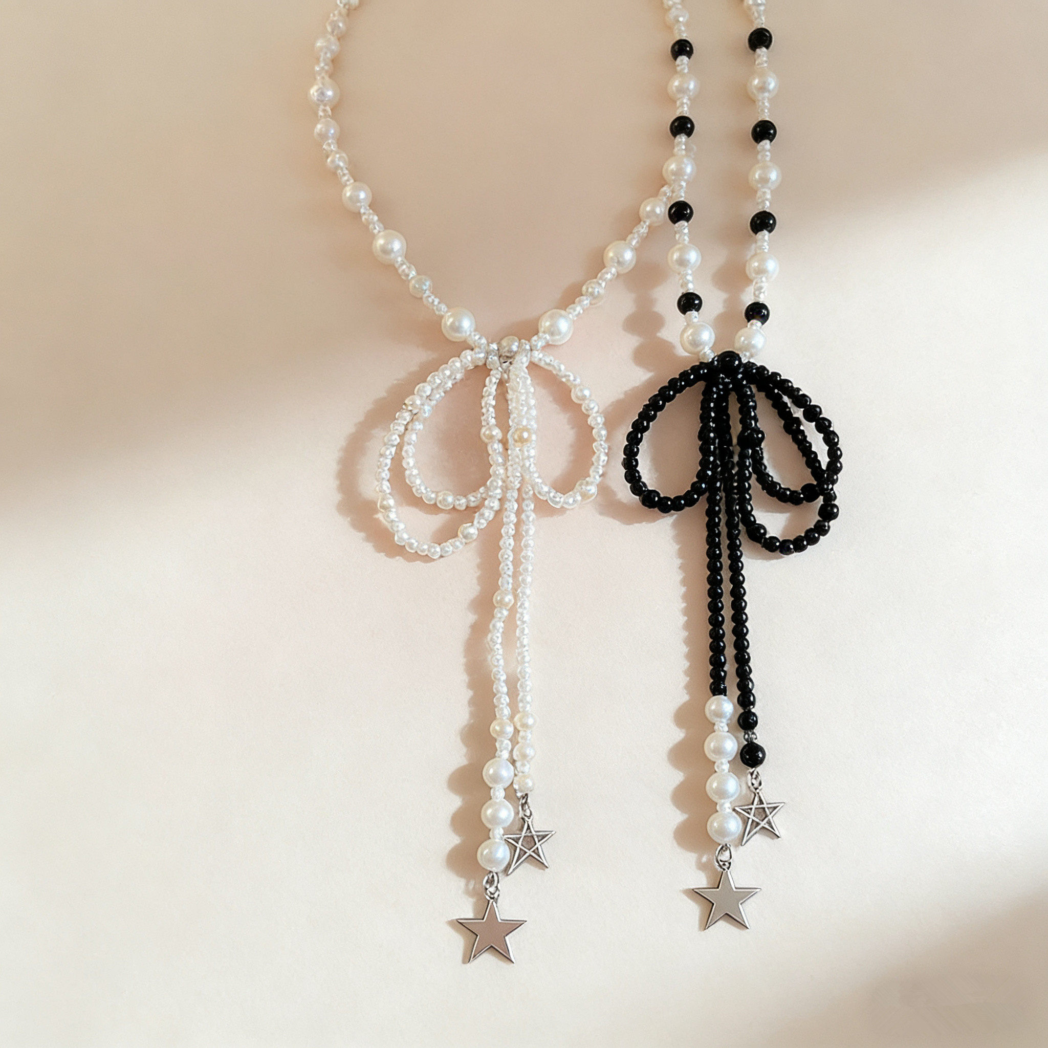 黑白珍珠蝴蝶结项链女锁骨链春夏新款星星吊坠流苏长款配饰颈链