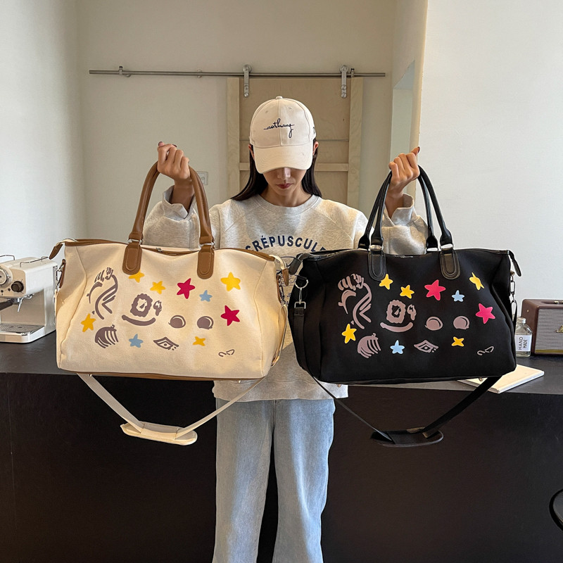 可爱风帆布涂鸦旅行大包短途出门学生装衣服行李包健身鞋仓斜跨包