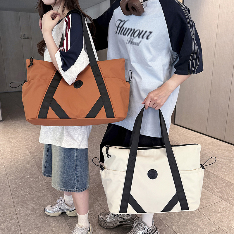 结实尼龙套拉杆装衣服旅行女包