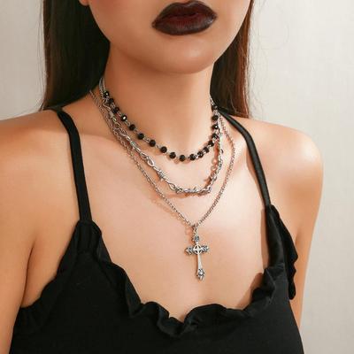 Neck chain cross pendant with dark collarbone chain