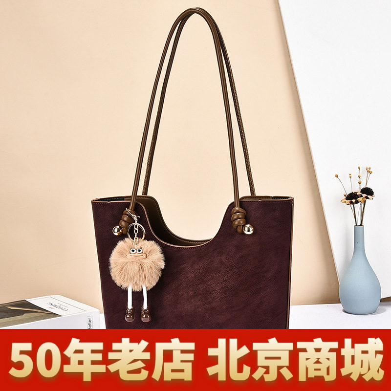 洋气复古拼色包包女2026秋冬新款通勤单肩斜挎包高级感手提水桶包
