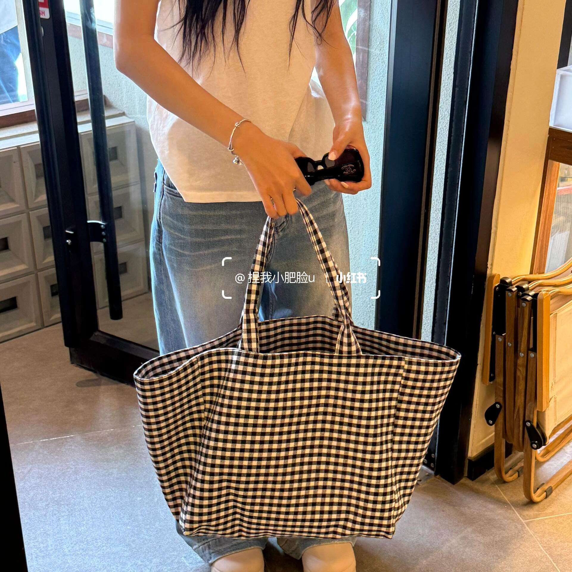 韩版慵懒感通勤大托特包黑白格单肩收纳购物袋帆布2025新款大容量
