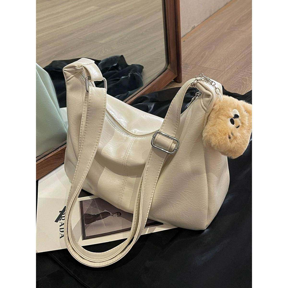 轻奢潮牌C.Keline包包女大容量2025新款高级感纯色单肩斜挎饺子包