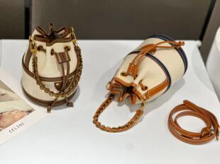 香港真皮流行拉绳水桶包2024新款圆筒包高级感手提单肩斜挎包包女