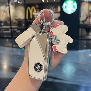 适用于宝马钥匙套24款7系新X5L5系X1i5i7X735li高档X6XM女iX1扣壳