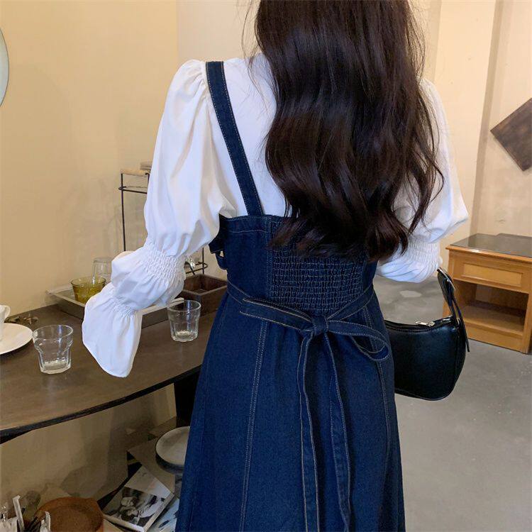 深蓝色牛仔吊带连衣裙女秋季气质收腰显瘦绑带设计感长短款背带裙