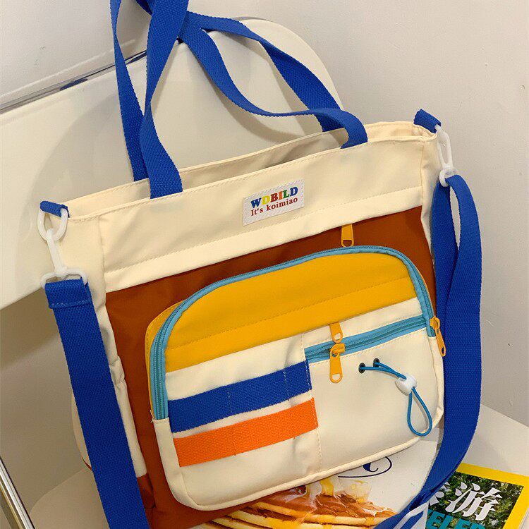 撞色单肩斜跨包小学生大