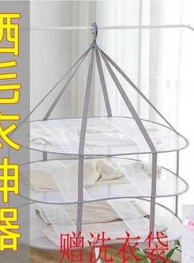 Sweaters are hung on domestic clotheslines. Clothes cool