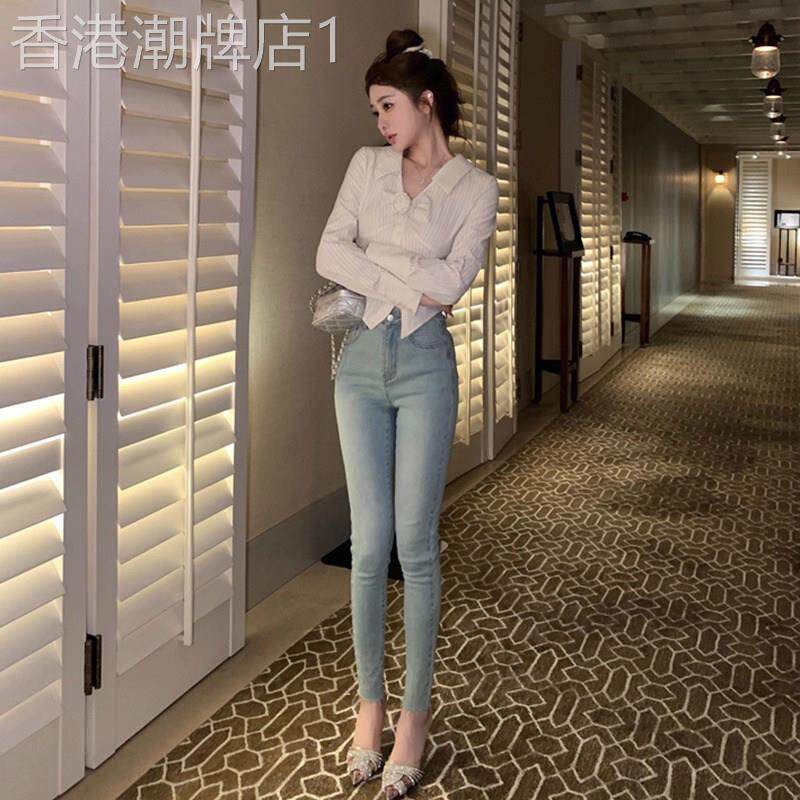 浅色辣妹提臀高腰牛仔裤女2026年春夏季弹力紧身百搭毛边小脚裤子