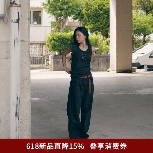 SPELLEDIT弧形剪裁黑牛仔裤