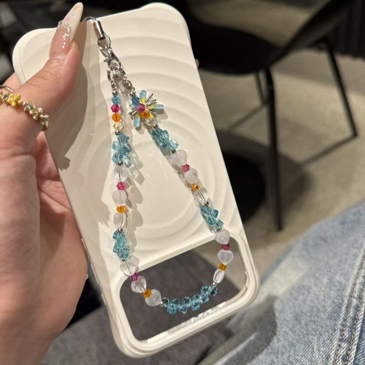 金洋壳蓝水晶烟花手机链新品上新