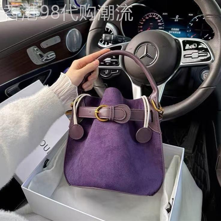 香港it代购高级感紫色丝绒水桶包包女通勤潮单肩斜挎包真皮机车包