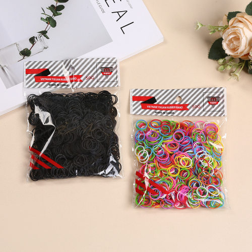 Disposable black bag with small rubber bands for hair cutti