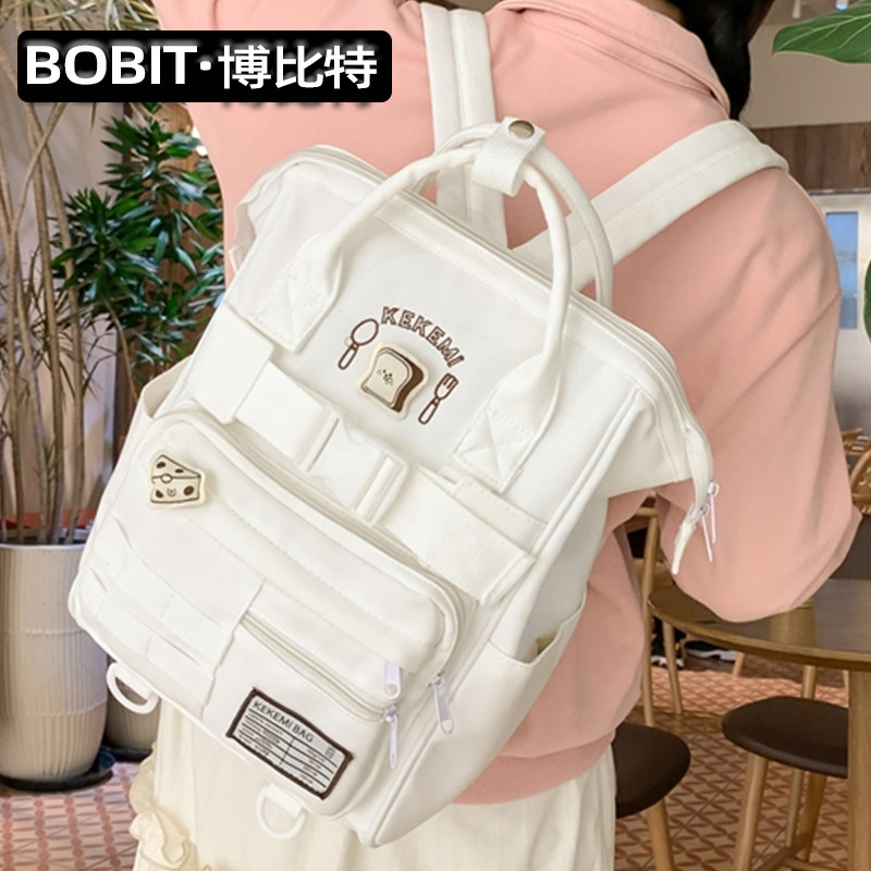 手提双肩包女生高颜值学院风背包大容量初中高中学生书包男小学生