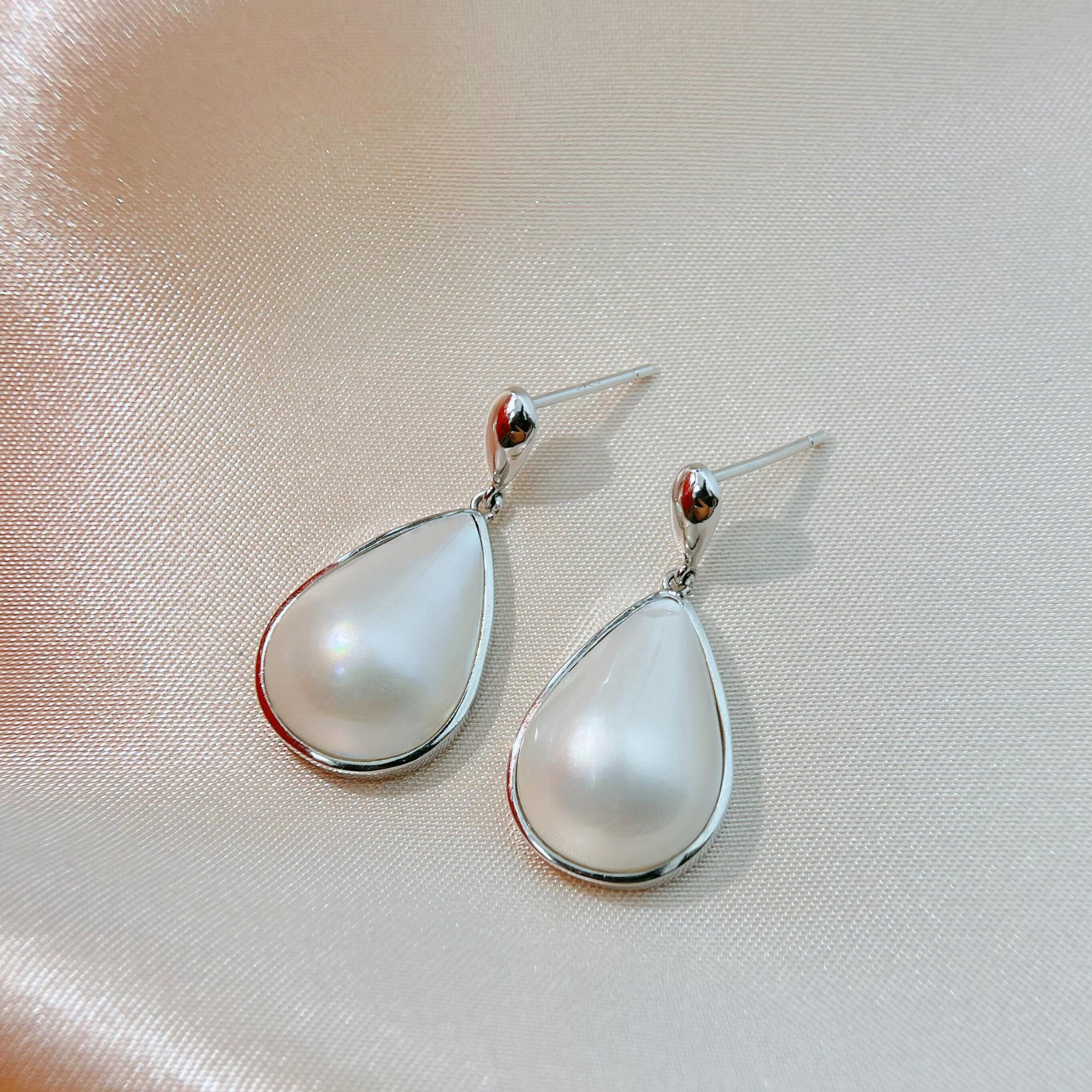 灵动款海水水滴白马贝纯银耳坠