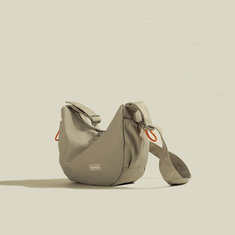 日系帆布包大容量枕头包包女式2025新款夏季轻便通勤斜挎饺子包女