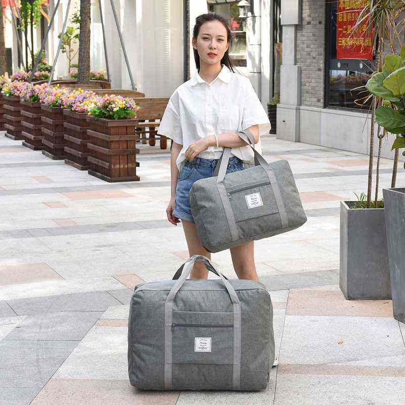 .韩版超大容量旅行袋女手提旅行李包搬家托运袋帆布棉被收纳游袋