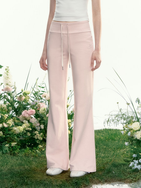 Light pink wide-leg drawstring pants worn by a model