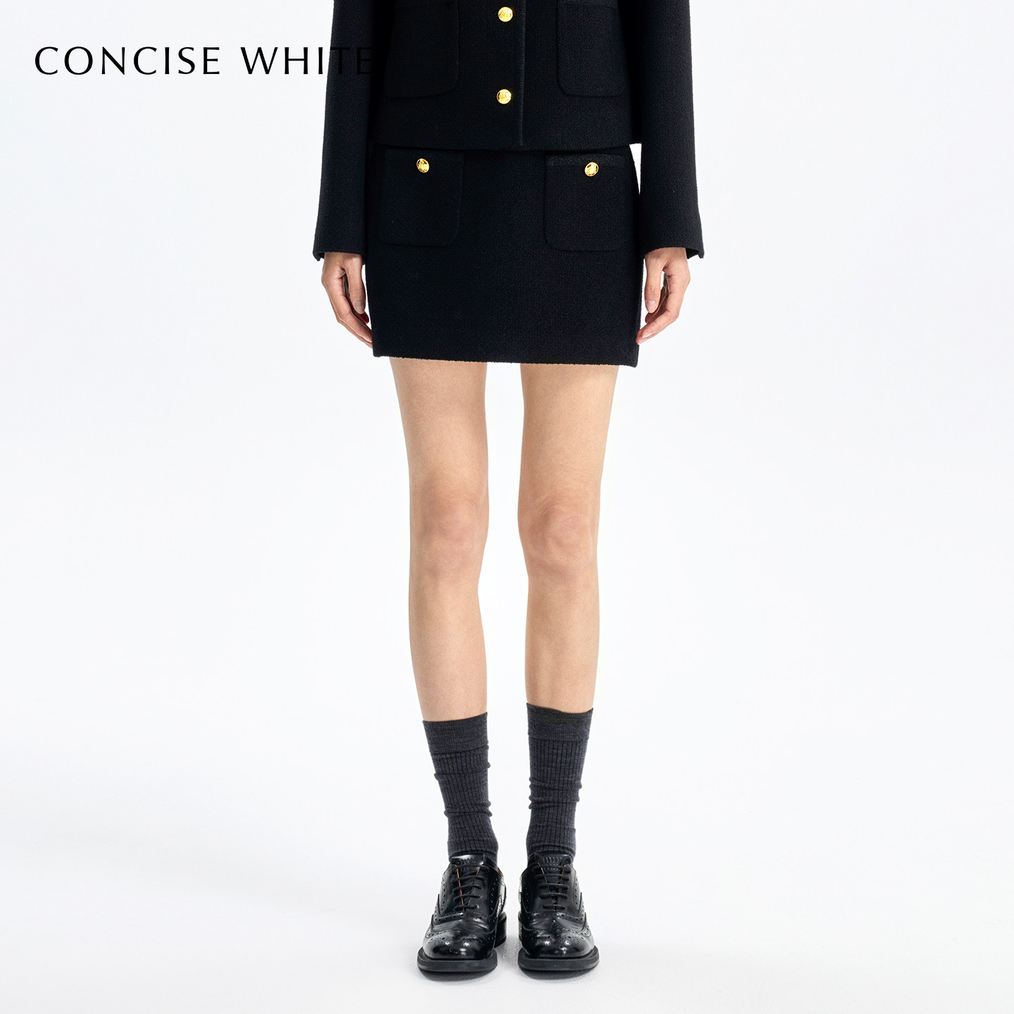 CONCISE-WHITE简白2025秋冬新品金扣短半裙黑色高级羊毛半身裙女