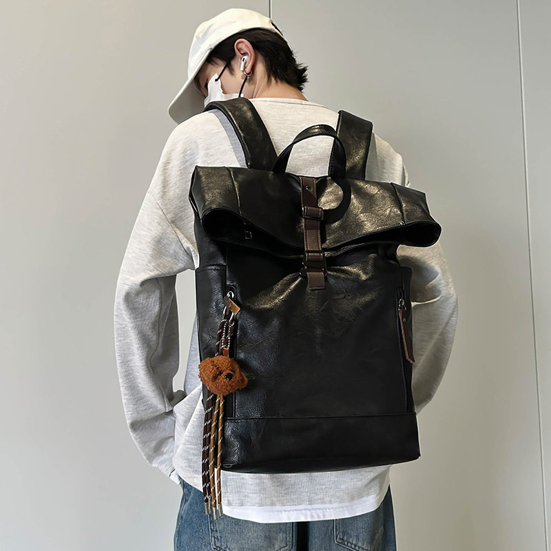 男士电脑背包2025新款机车风皮质防水旅行背包大学生上课双肩书包