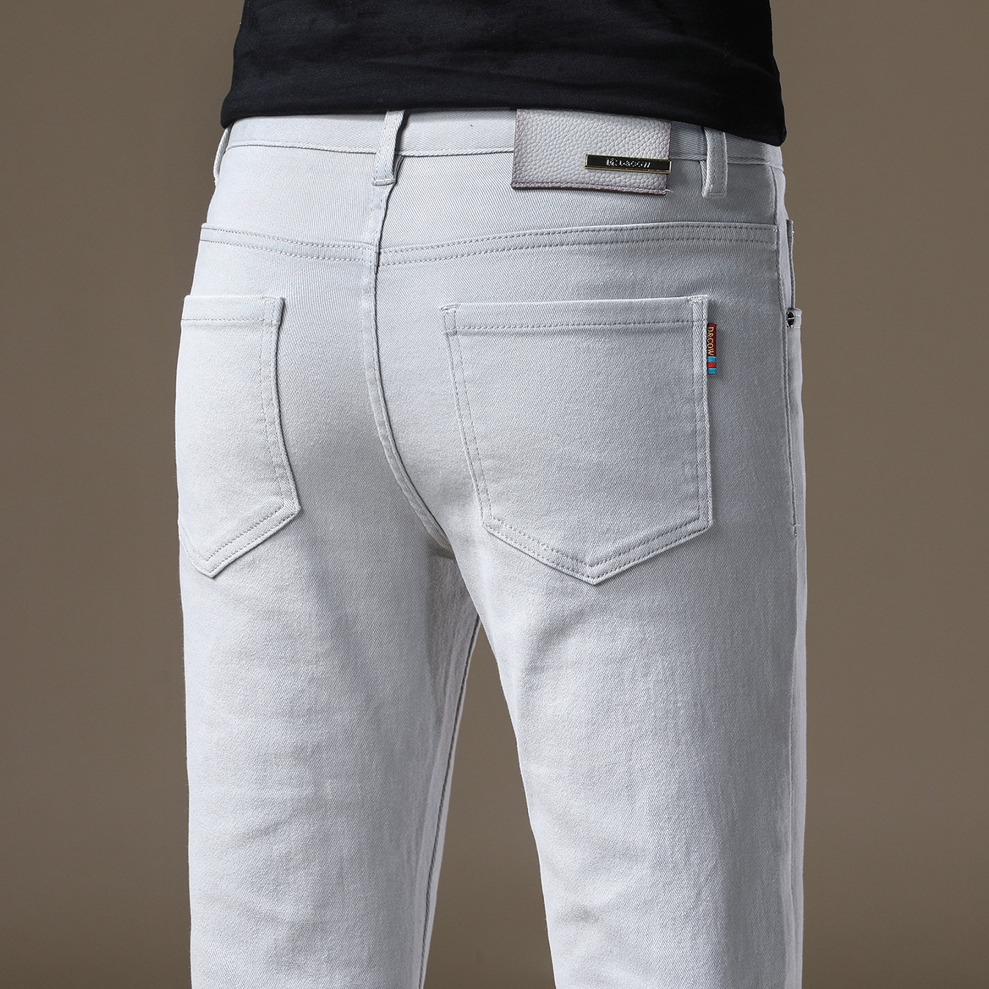 2025新款高端品牌米灰色牛仔裤男韩版修身小脚秋冬厚款休闲裤子男