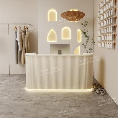 高端轻奢奶油风服装店收银台吧台店铺小型美容院烤漆弧形前台接待