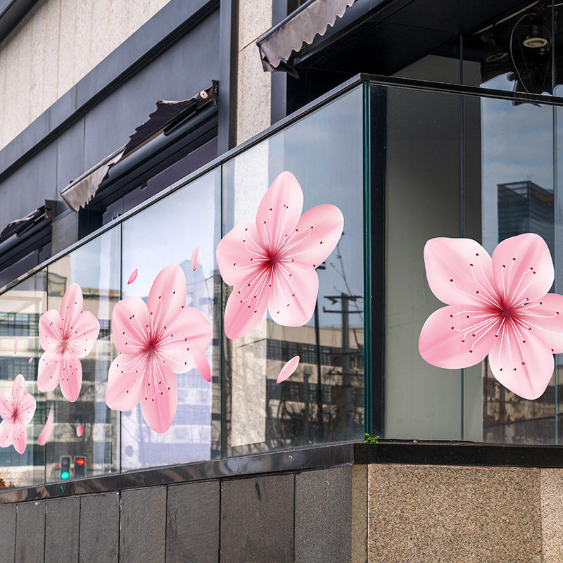 商场玻璃扶手栏杆女装服饰店春季新品橱窗樱花氛围布置静电贴膜