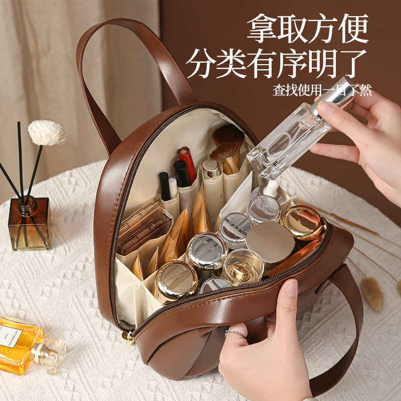 美拉德贝壳手提化妆包大容量2025新款便携式外出化妆品分区收纳袋