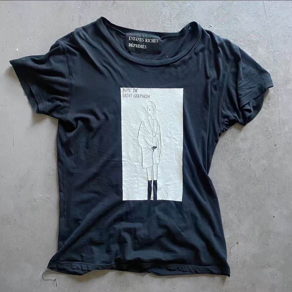 thumbnail for ERD's melancholic rich second generation 'Whore of St. Germain' portrait printed short-sleeved T-shirt with a woman with a gun